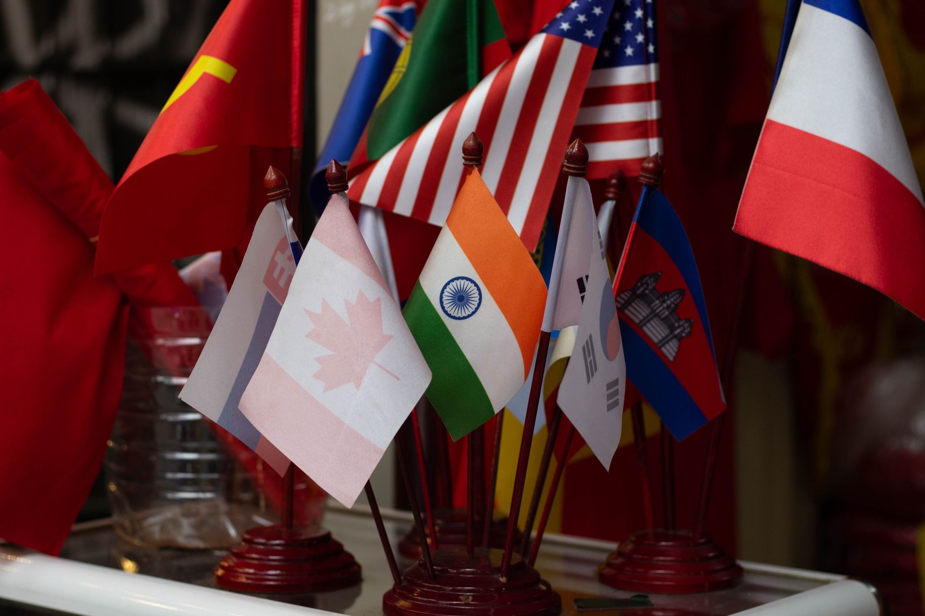 Km Nonstop Flight in Practice — Colorful display of multiple national flags on stands, showcasing international (photo: Paresh Patil)