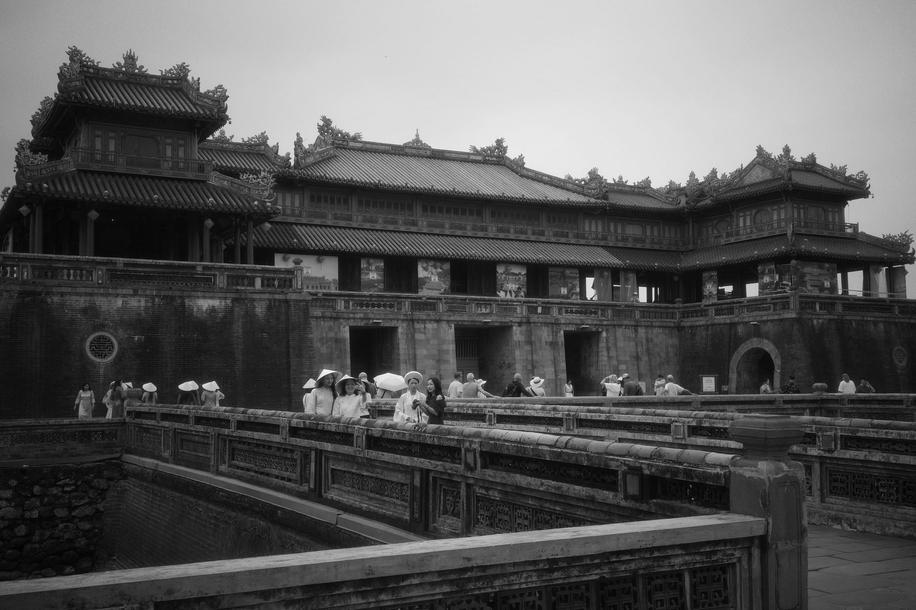 What to Expect on the Ground — Tourists explore the Imperial City in Hue, Vietnam, showcasing its classic archi (photo: Quang Bach)