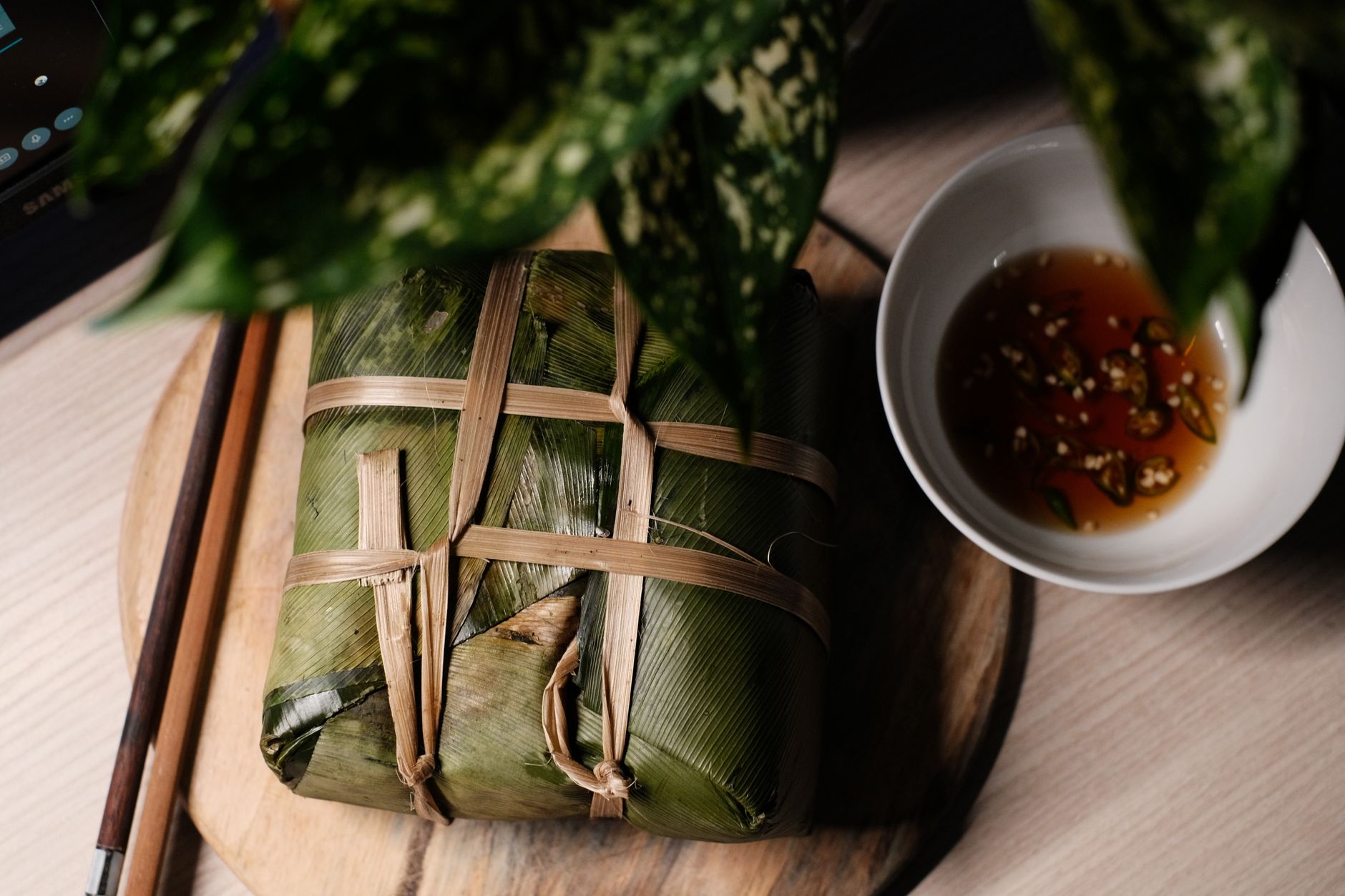 Banh Mi Festival in Practice — Delicious Vietnamese rice cake wrapped in leaves, paired with a savory dipping s (photo: Pew Nguyen)