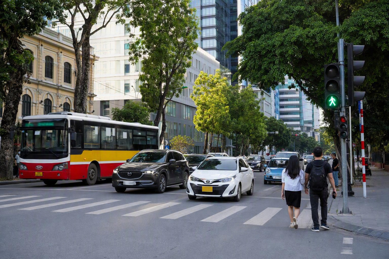Hanoi street crossing at a traffic light on a larger city road