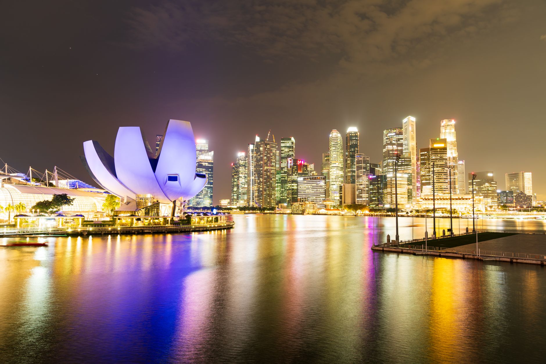 Nearby Ideas — Night view of Singapore's illuminated skyline and Marina Bay Sands, reflecting v (photo: Mark Baldovino)