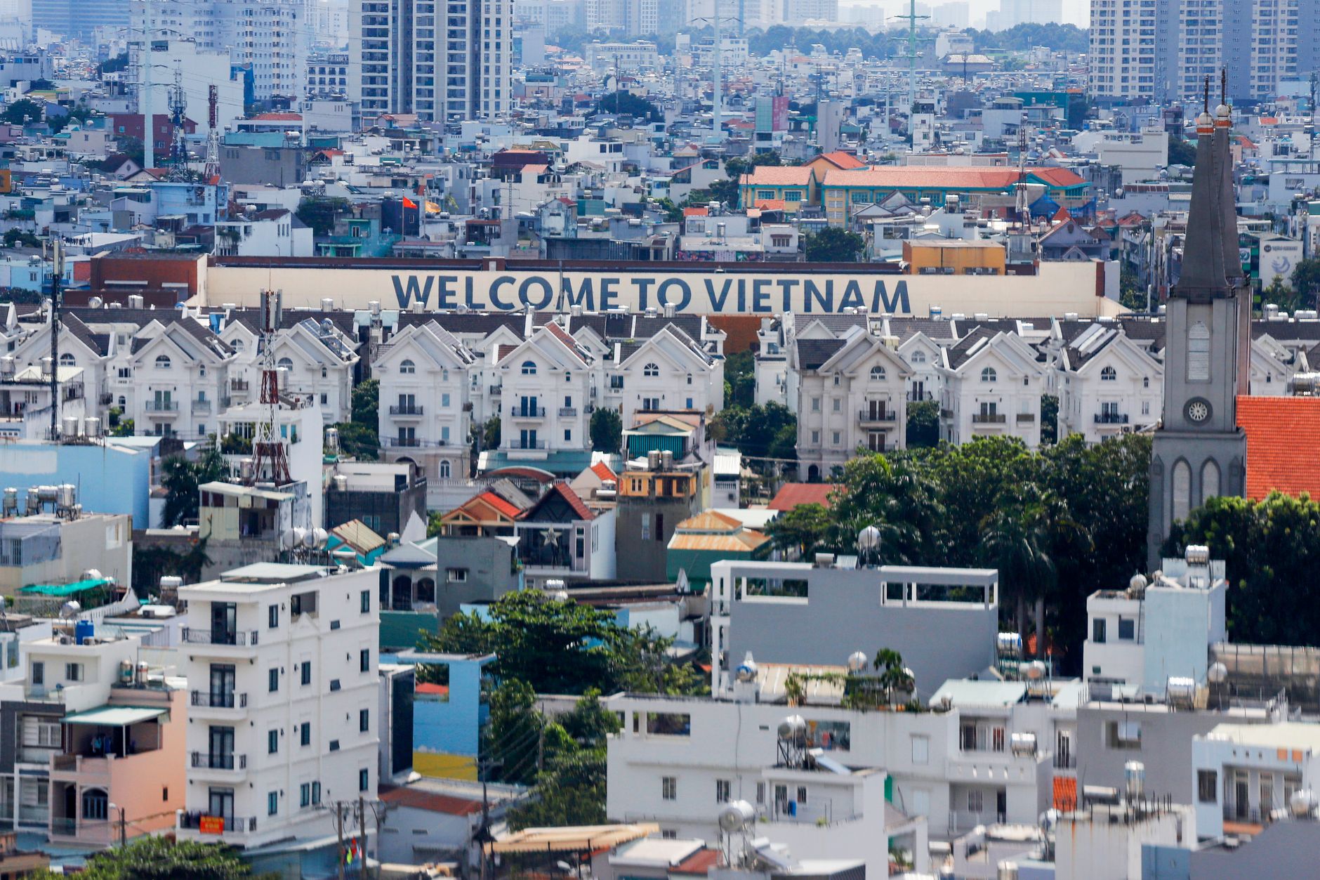 Additional notes — A vibrant aerial view of Ho Chi Minh City featuring the iconic 'Welcome to Vietn (photo: Nhựt Nguyên Trần)