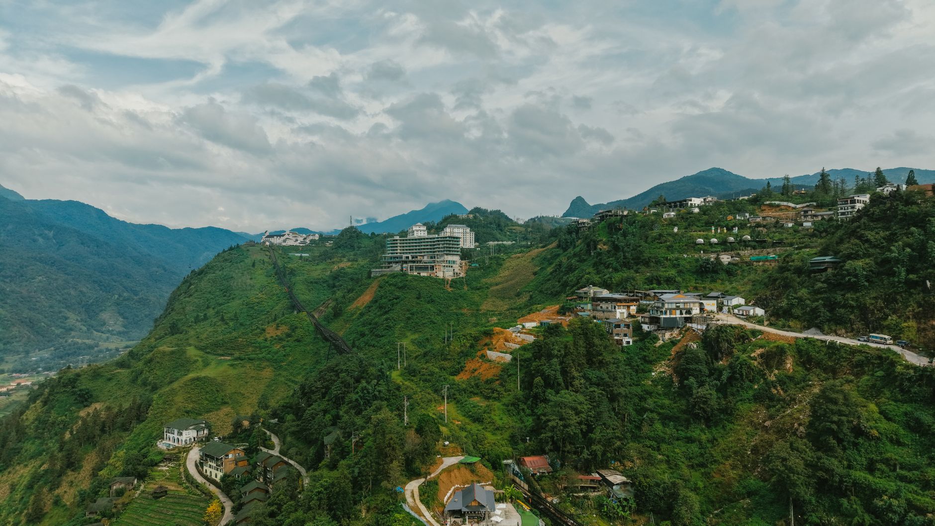Southeast Asian in Practice — Stunning aerial landscape of green hills and modern buildings in Sapa, Vietnam. (photo: HONG SON)