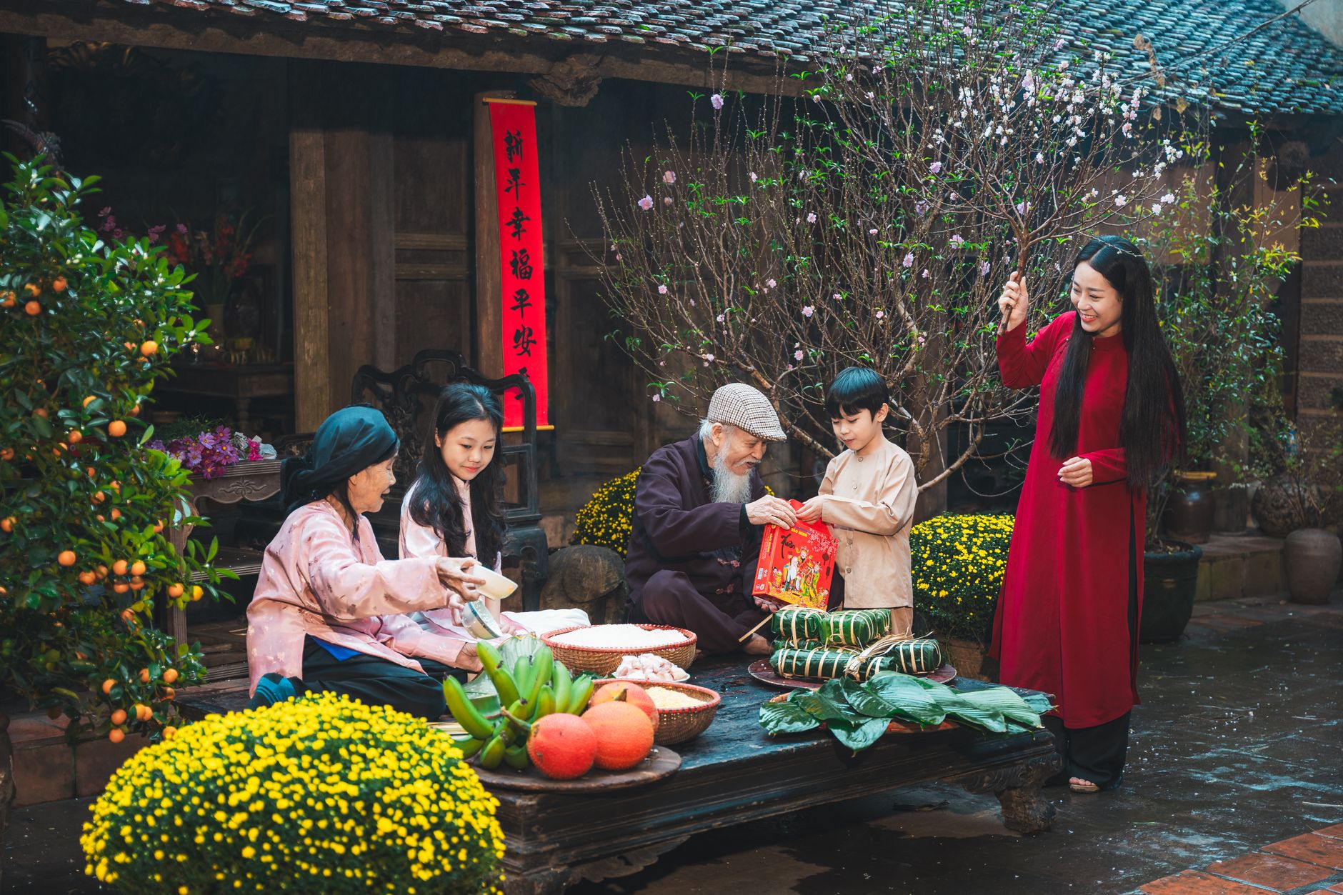 What to Expect on the Ground — Family engaging in traditional Tet New Year celebrations in Hanoi, showcasing cu (photo: Hoach Le Dinh)
