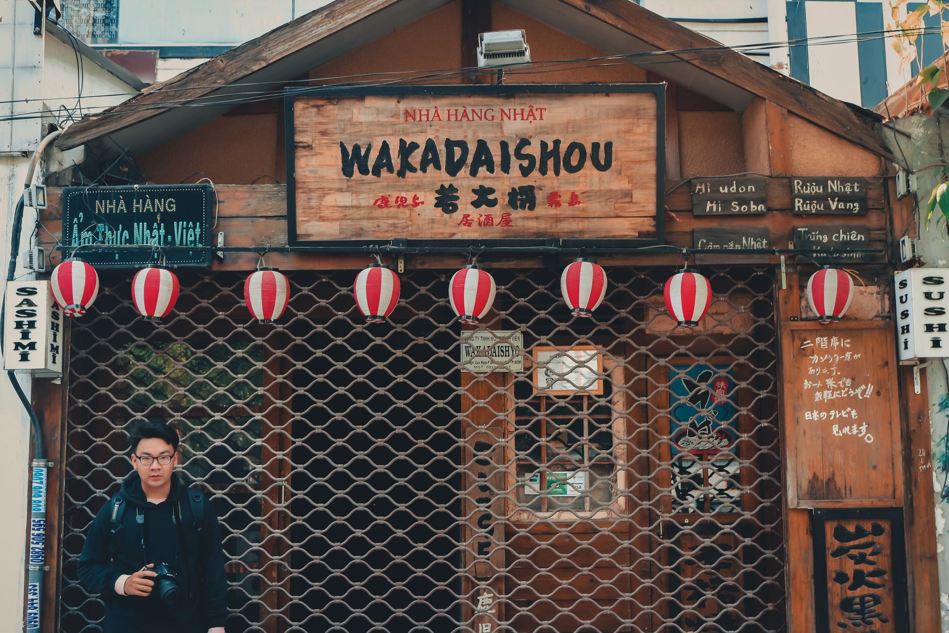 What to Expect on the Ground — A closed Japanese restaurant with red and white lanterns and signage, featuring (photo: Min An)