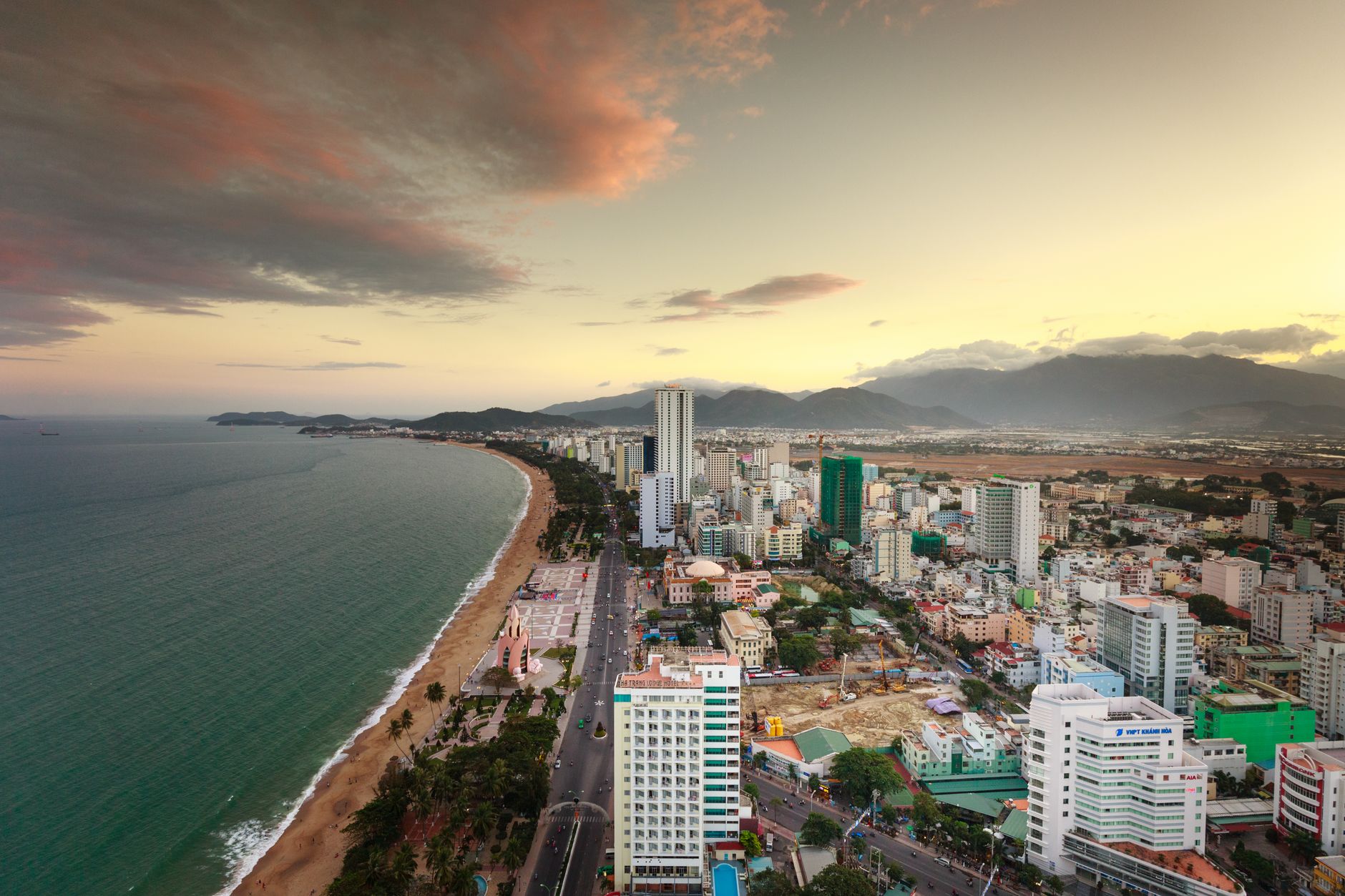 Conclusion — A stunning aerial view of a coastal city at dawn with a vibrant skyline and scen (photo: Quang Nguyen Vinh)