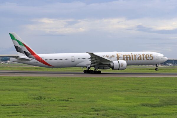 Emirates jet captured during takeoff on a clear day at the airport runway. — photo: Jeffry Surianto